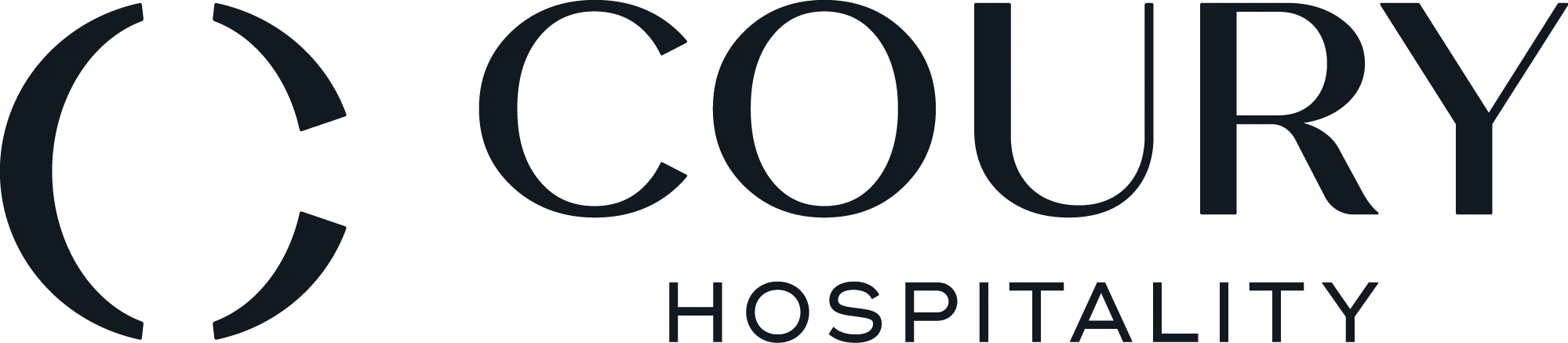 The image shows the logo of "Coury Hospitality," featuring stylized text with a semicircular design element. logo on footer section. Link to external website.